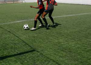 Two Boys play with football 