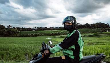 a man in a helmet is sitting on a motorcycle safety