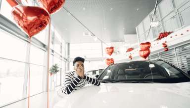 A women expressing her feelings on buying a new car