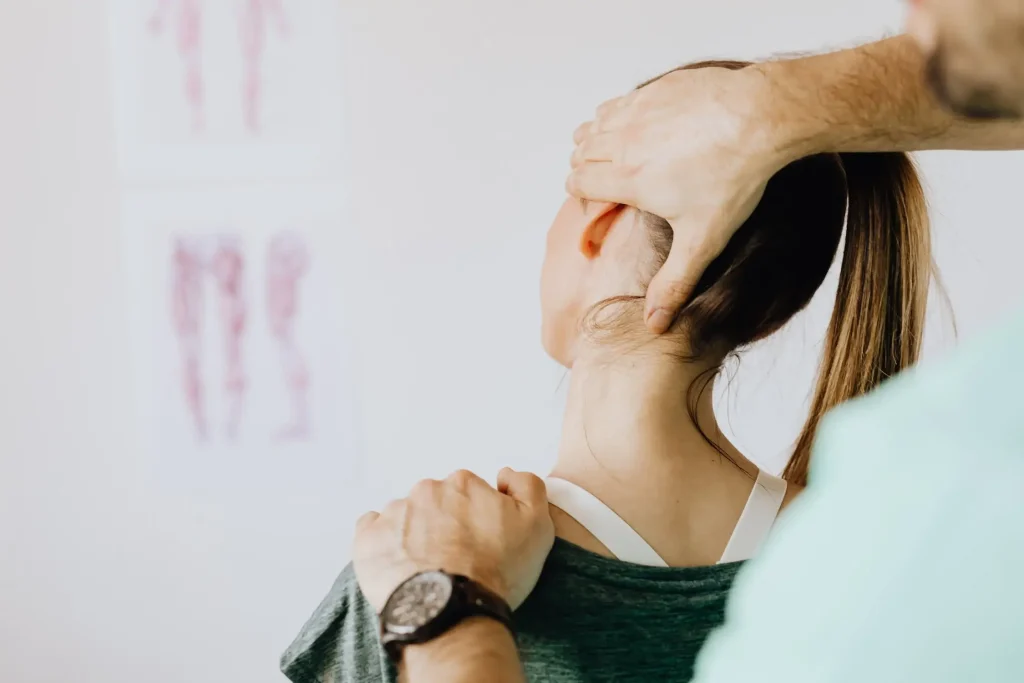 a woman getting a spine issued to check from doctor